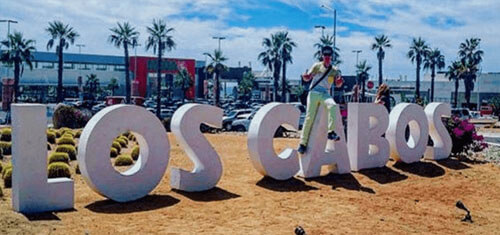 Picture of a Los Cabos sign in Los Cabos, Mexico. The picture shows white letters on the beach spelling out Los Cabos.